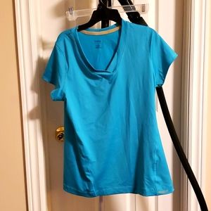 Large teal athletic Reebok t shirt for women.